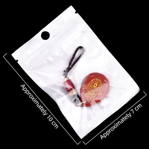 Hamsa hand engraved red stone teardrop keychain with decorative beads on black cord