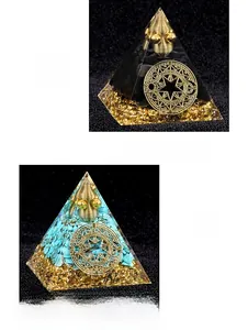 Detail of Orgonite pyramid with obsidian turquoise and copper coil in resin