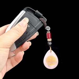 Rose quartz water drop keychain with golden tree of life symbol on braided rope
