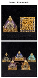 Macro detail of orgone energy pyramid with natural crystals, gold foil, and metal mandala