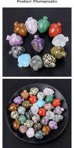 Detailed view of hand-carved crystal acorns in various gemstones on a black ceramic plate