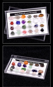 Macro shot of 24 natural polished gemstones in a clear acrylic display case with labels