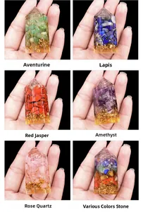 Macro shot of handcrafted hexagonal crystal resin point with natural stones and gold foil