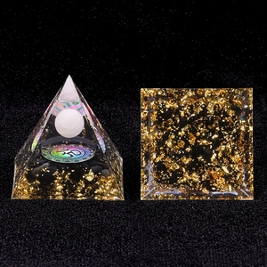 Handmade Orgone Crystal Pyramid with Om symbol and golden leaf resin decor for desk