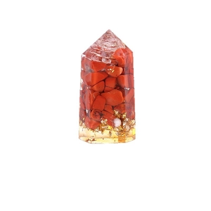 Orgone obelisk featuring red jasper stones and gold leaf chips in transparent resin
