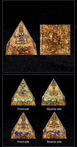 Detailed macro view of Orgone pyramid with amethyst crystals and golden Buddha accents