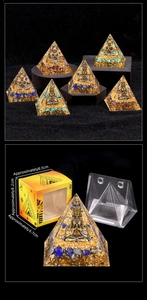 Detailed view of handmade crystal Orgone pyramid with natural amethyst and gold foil flakes