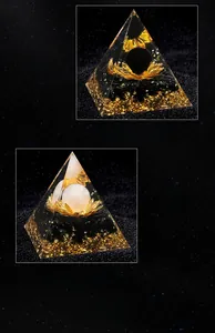 Macro detail of C4 and C5 Orgone pyramids with lotus symbols and obsidian crushed stones