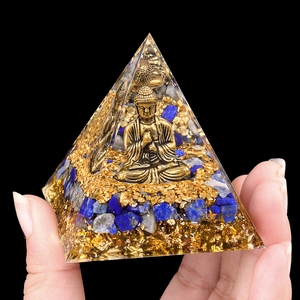 Handheld Orgone pyramid with golden Buddha, Lapis Lazuli and gold foil in resin