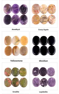 Polished oval worry stones in amethyst, crazy agate, and various natural gemstones