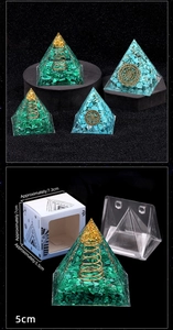 Detailed macro view of natural malachite orgone pyramid with copper spiral and gift box