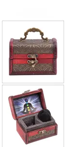 Red vintage wooden jewelry box featuring golden patterns and chakra meditation inner lid