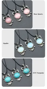 Detailed view of owl pendants in rose quartz, opalite, and turquoise with silver carvings