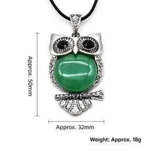 Green gemstone owl pendant necklace in silver vintage frame with black woven cord