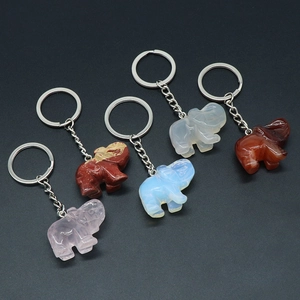 Set of five natural crystal and agate elephant keychains with polished gemstone carving