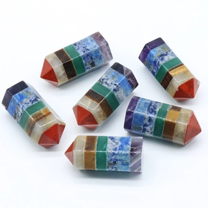 Polished seven chakra hexagonal crystal columns made of layered natural gemstones