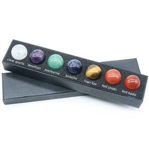 Set of 7 chakra natural crystal spheres including amethyst and tiger eye in a black gift box