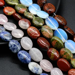 Detailed view of assorted oval gemstone beads including lapis lazuli and agate for DIY jewelry