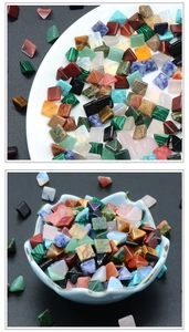 Macro shot of colorful pyramid-shaped gemstone cabochons for jewelry making DIY