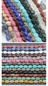 Close-up of polished oval semi-precious stone beads including lapis and quartz for DIY