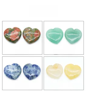 Macro display of heart-shaped Unakite, Aventurine, Sodalite, and Yellow Jade gemstones