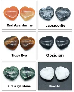 Macro shot of 25mm polished heart-shaped natural crystals in various mineral materials