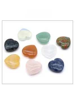 Detailed view of nine polished natural crystal heart stones in various gemstones and colors