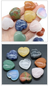 Macro shot of polished assorted natural crystal heart stones showing smooth textures
