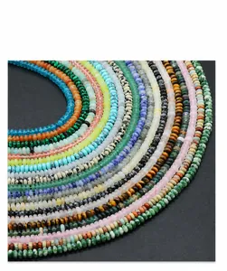 Macro shot of 2x4mm natural gemstone beads in various colors for jewelry making