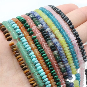 Natural mixed gemstone abacus beads 2x4mm strand held in hand for DIY jewelry making