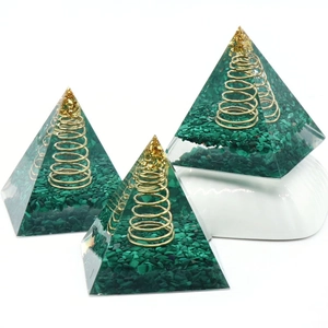 Malachite orgone pyramid set with copper coil and gold foil in clear resin base