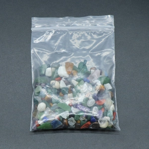 Mix of colorful polished natural crystal stones and gemstones in a clear sealed bag