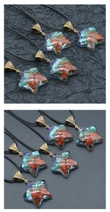 Macro detail of star-shaped Orgonite pendant with chakra stones and metal spiral