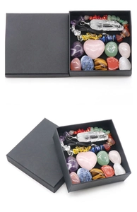 Detailed macro view of the crystal healing set including heart stone and chakra beads