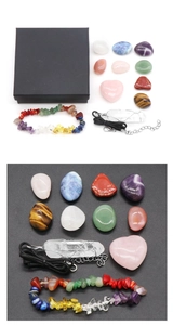 Macro detail of natural crystal healing set with stone bracelet and heart quartz