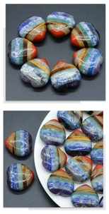 Detailed close-up of polished 30mm heart-shaped seven chakra natural crystal energy stones