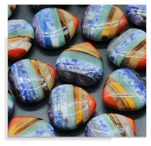 Macro detail of hand-polished heart-shaped chakra stone with layered natural minerals