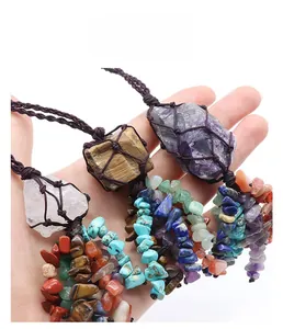 Close-up of handmade woven pendant featuring raw natural amethyst and healing crystals