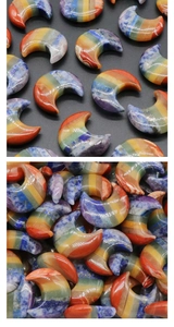 Detailed view of polished moon-shaped chakra healing stones in various natural crystals