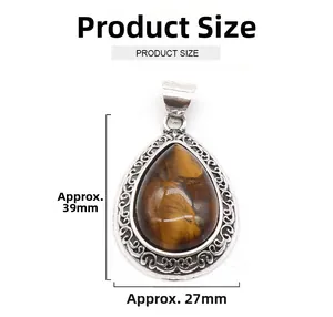 Detail view of teardrop tiger eye pendant dimensions measuring 39mm in height and 27mm in width