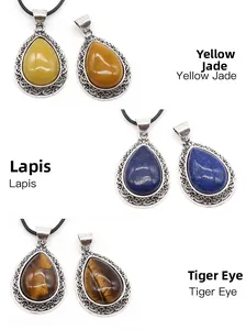 Detail of waterdrop pendants in yellow jade, lapis and tiger eye with silver metal wrap