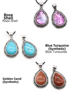 Detail of drop pendants in rose shell, blue turquoise, and gold sandstone textures