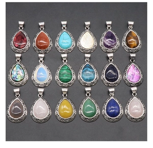 Macro view of 18 teardrop gemstone pendants with vintage silver engraved floral frames