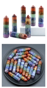 Macro detail of hexagonal 7 chakra healing crystal columns with polished layered stones