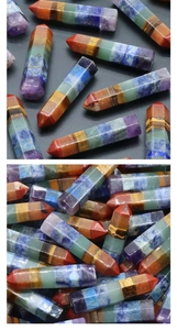 Macro shot of 7 chakra hexagonal crystal columns showing layered natural stones