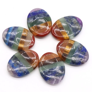Set of six oval 7 chakra healing stones with colorful polished natural crystal layers