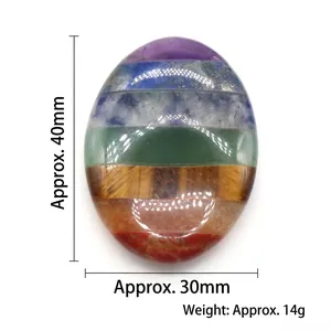 Polished 40mm Chakra worry stone made of layered natural crystals for meditation