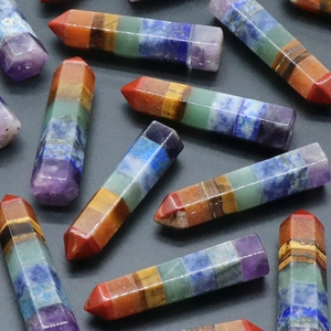 Polished hexagonal column chakra stones crafted with seven colors of natural crystal gems