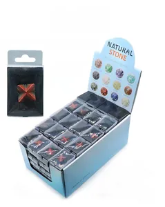 Macro detail of Merkaba star crystal in PVC box with blue display carton packaging