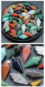 Detailed macro view of assorted natural crystal cone pendants with silver metal clasps